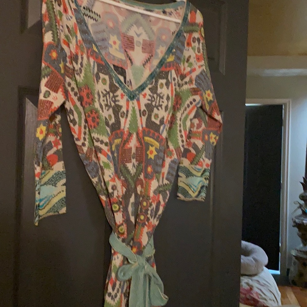 Short dress. Belted with v neck.
